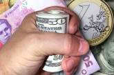 Украинцы меняют гривневые депозиты на валютные