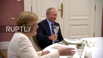  На фотке Путина и Меркель нашли оптическую иллюзию