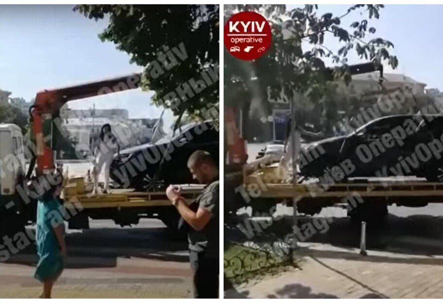 Киевлянка \"оседлала\" эвакуатор, защищая свой автомобиль (видео)